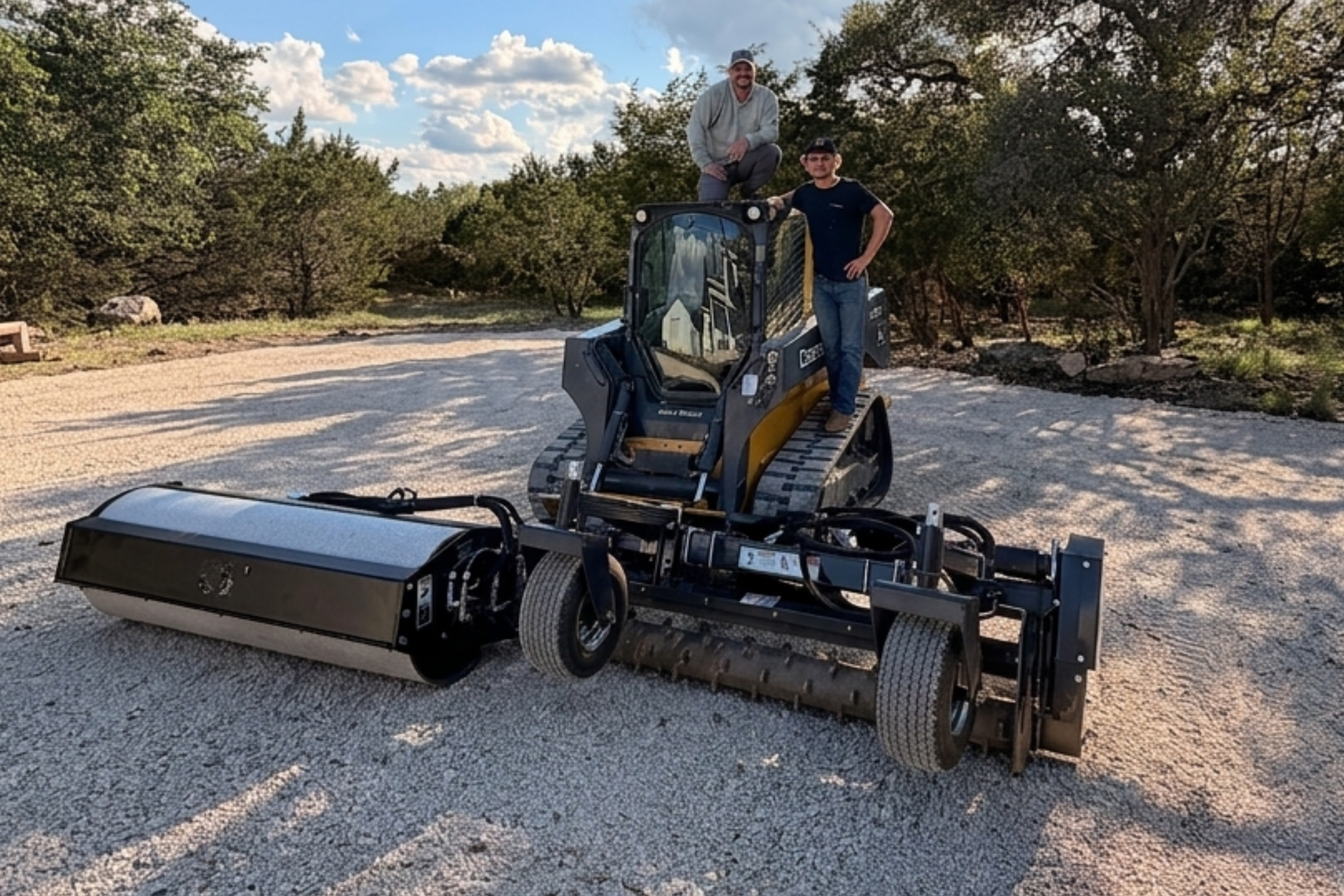 Compact track loader parked on gravel driveway