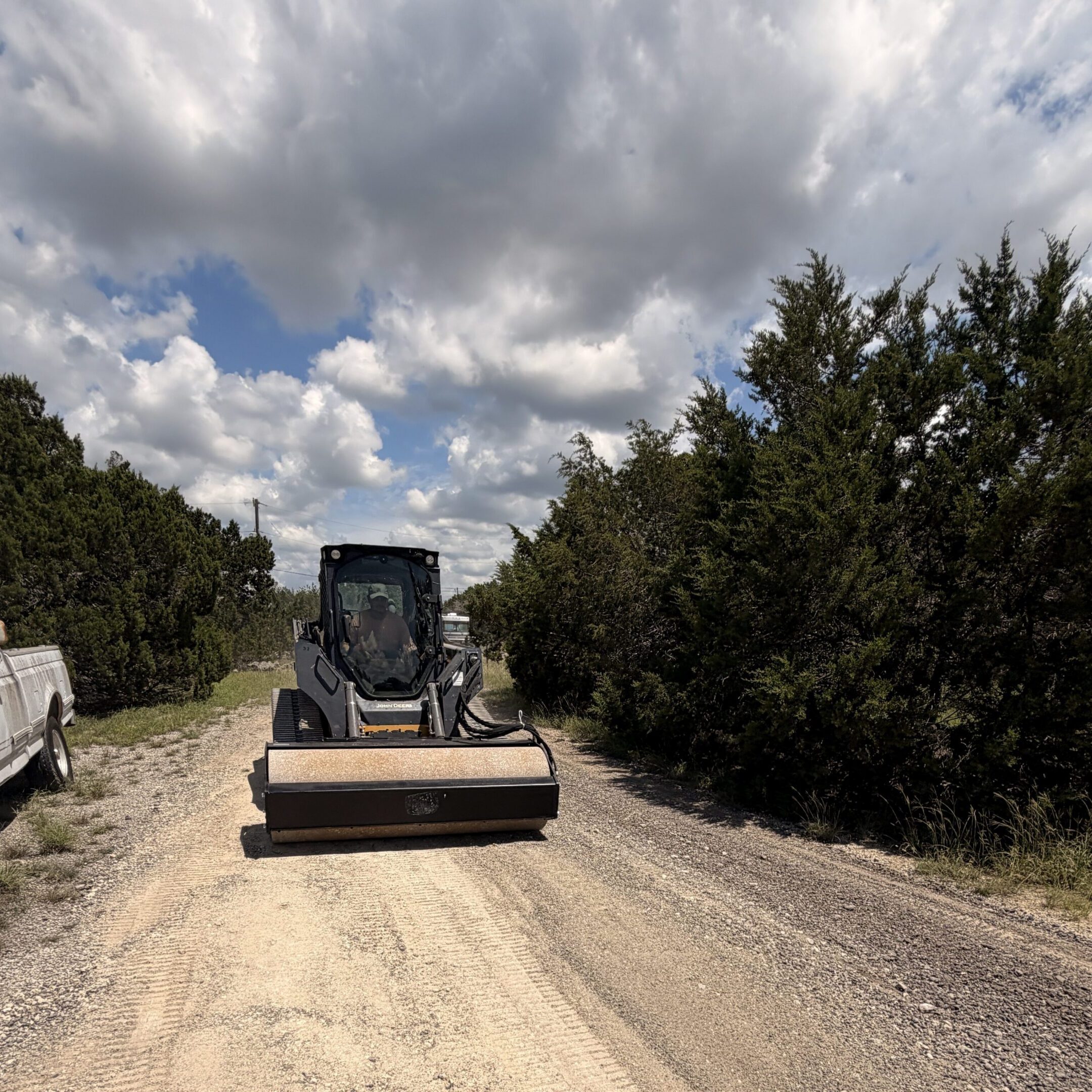 Small roller machine on rural gravel lane
